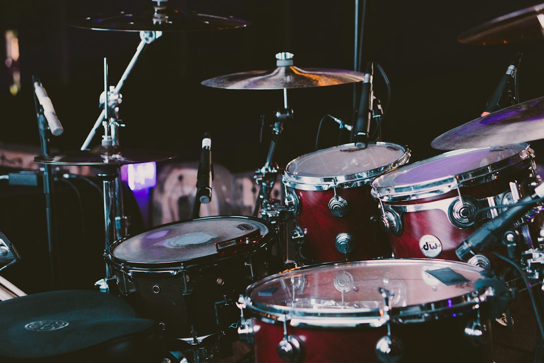 Red drum set in a recording space, representing the drum-break history discussed in the Funky Drummer article