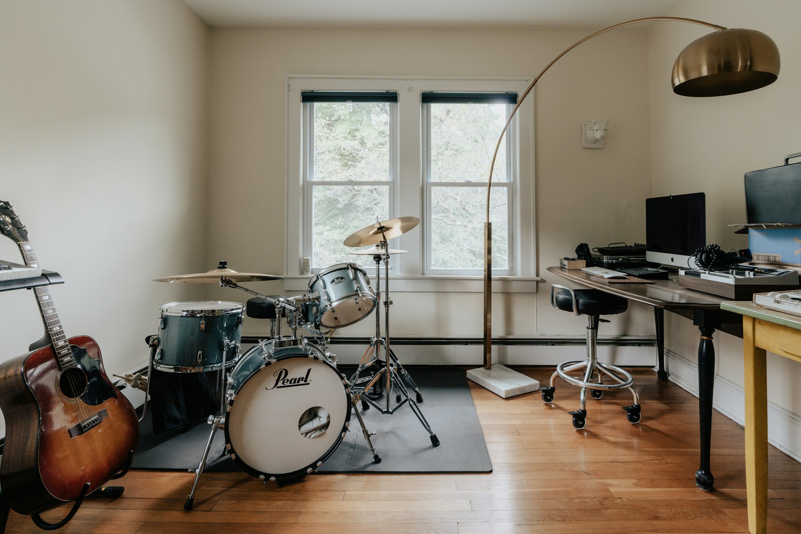 Home music recording studio with instruments and production equipment
